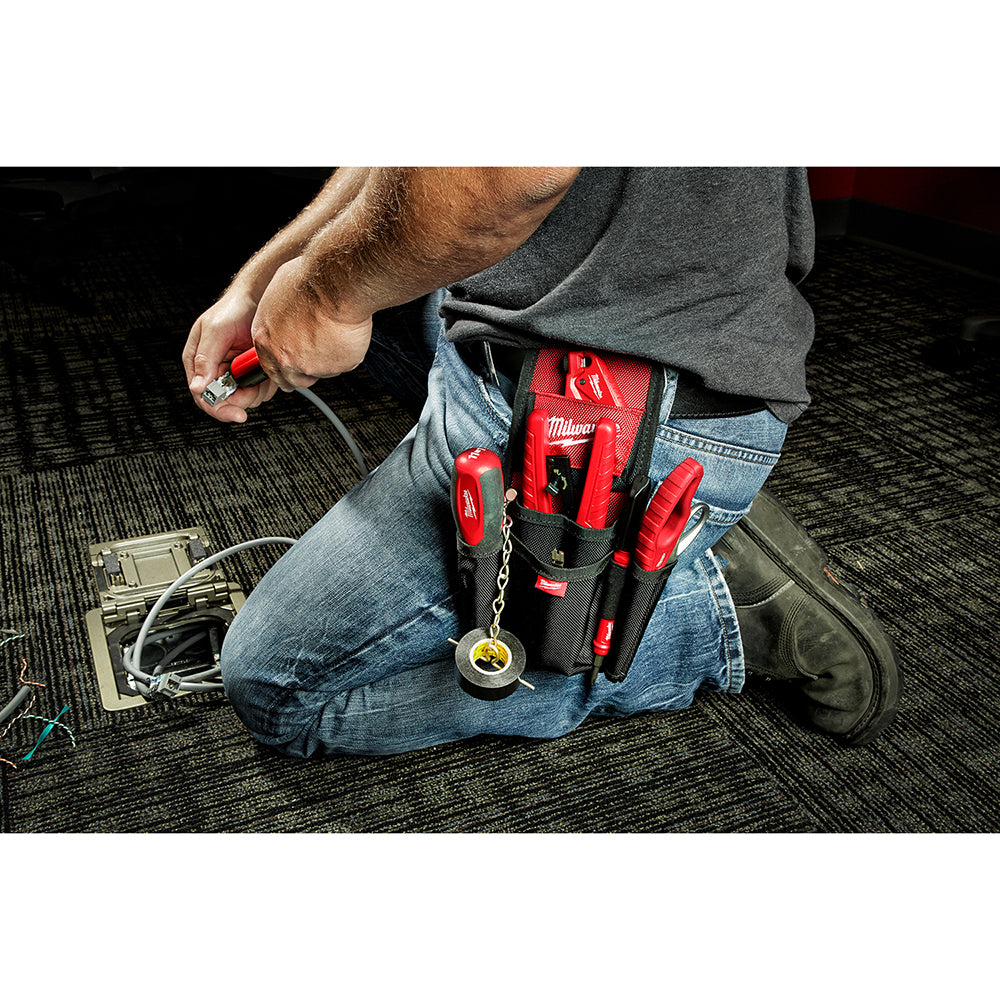 Red and black Milwaukee utility pouch worn on belt with multiple tool slots and a chain attachment.