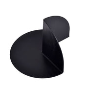 Black plastic corner dam with curved rounded edges and angled interior fold for shower pan waterproofing.