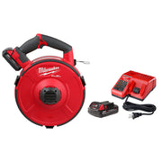 Milwaukee M18 FUEL red and black motorized fish tape reel with battery, charger, and power cord.