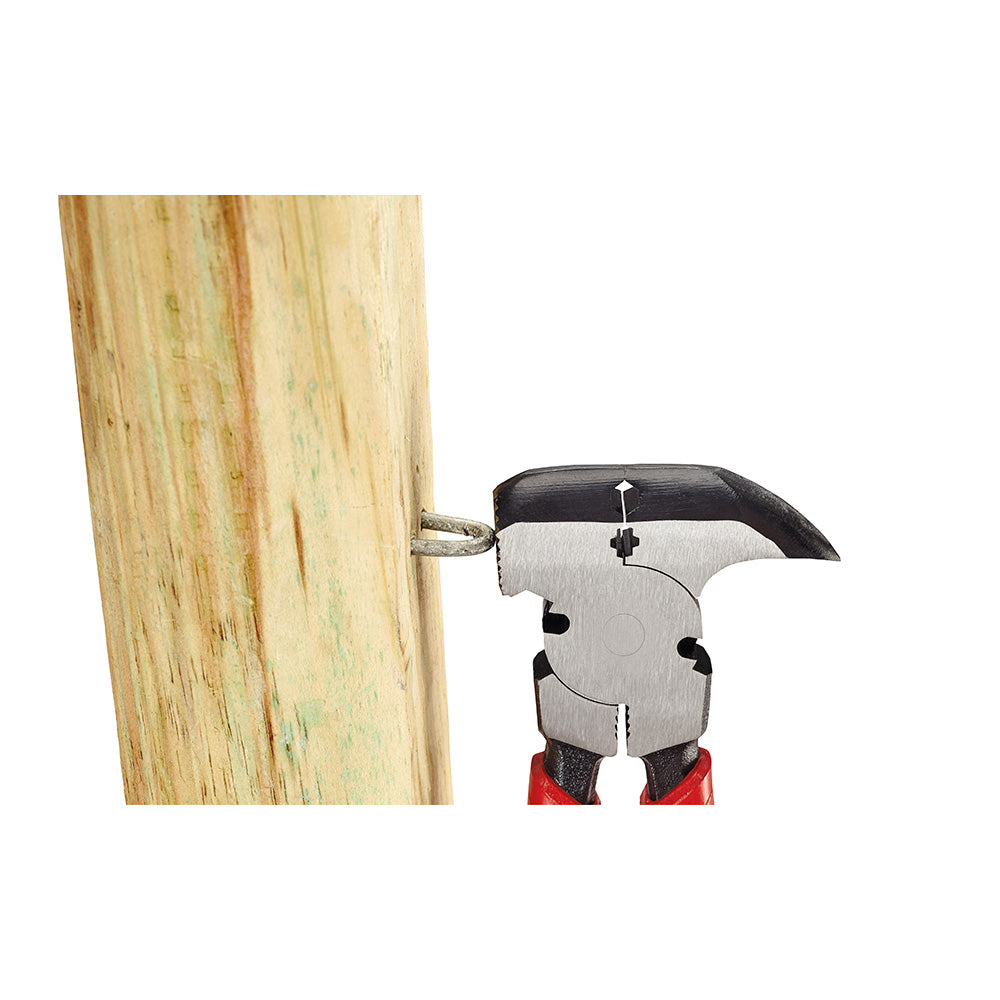 Milwaukee fencing pliers with curved jaw pulling a nail from wooden post.