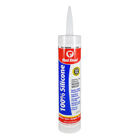 Tube of Red Devil 100% silicone sealant with gray applicator tip and red and blue label.