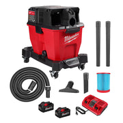Red and black Milwaukee 9-gallon wet/dry vacuum with hose, tubes, floor brush, filter, two batteries, and dual-port charger.