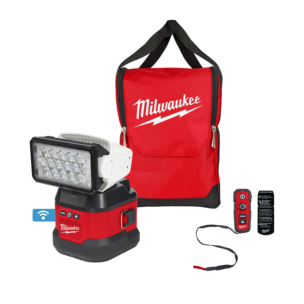 Milwaukee M18 search light with LED head, portable base, remote control, red canvas carrying bag, and power cable.