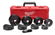 Milwaukee knockout set with red carrying case, four circular black cutting dies with red markings, four black adapter caps, a
