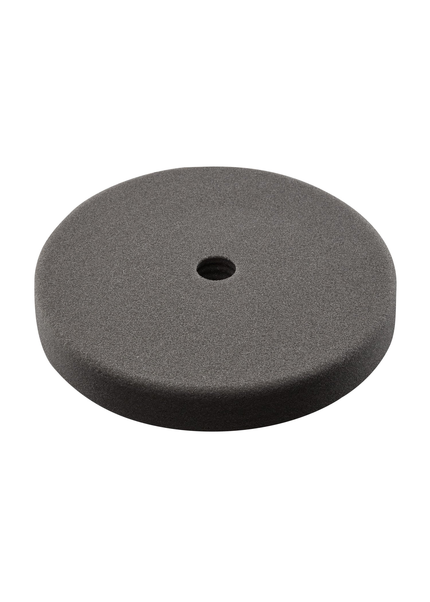 Black foam finishing pad, 7 inches in diameter, with center mounting hole.