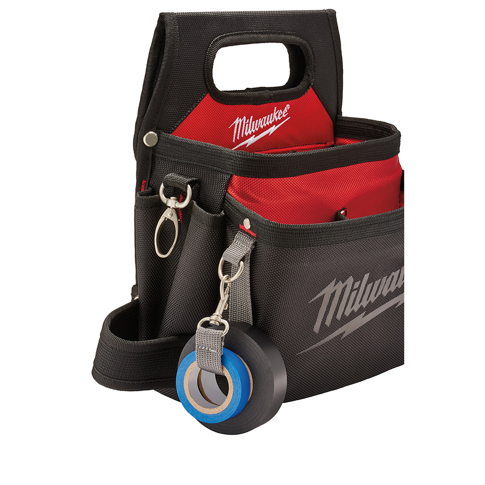 Black and red Milwaukee work pouch with handle, multiple pockets, belt loops, metal hardware, and attached tape measure holde