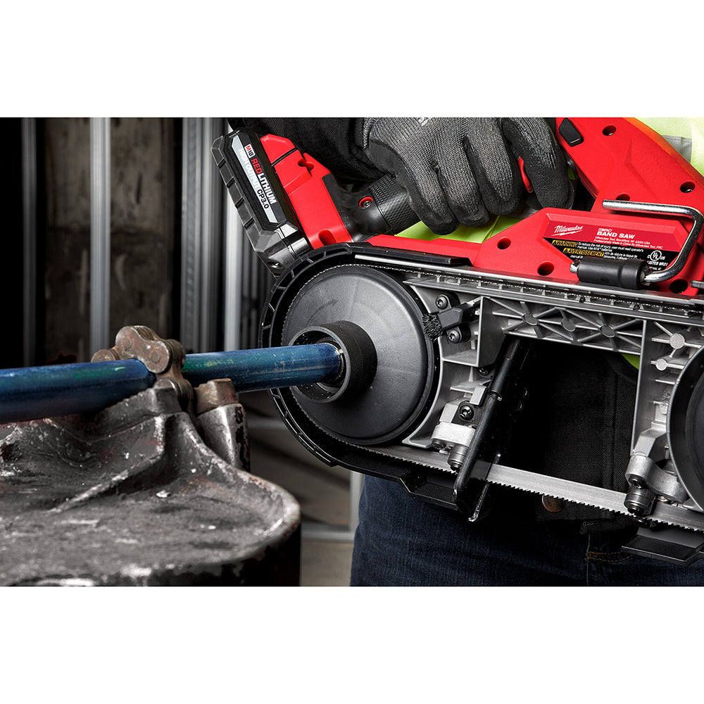 Red and black band saw reamer attachment mounted on Milwaukee compact band saw with blue metal pipe positioned in the reaming