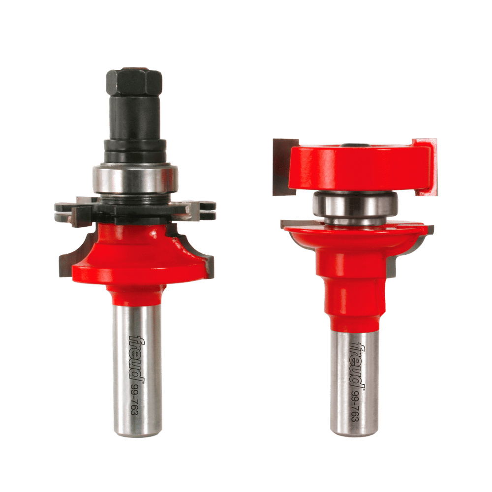 Two Freud router bits with red cutting heads and steel shanks, shown from front and side angles with adjustable components.