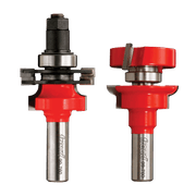 Two Freud router bits with red composite bodies, metal shanks, and adjustable rail and stile components shown from front and 