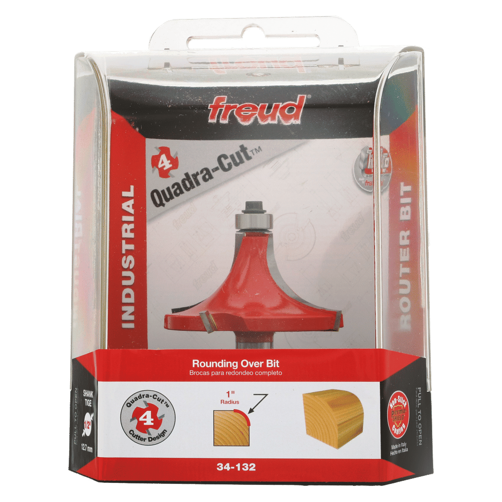 Freud Quadra-Cut rounding over bit with 1" radius in clear plastic clamshell packaging showing red router bit and wood sample