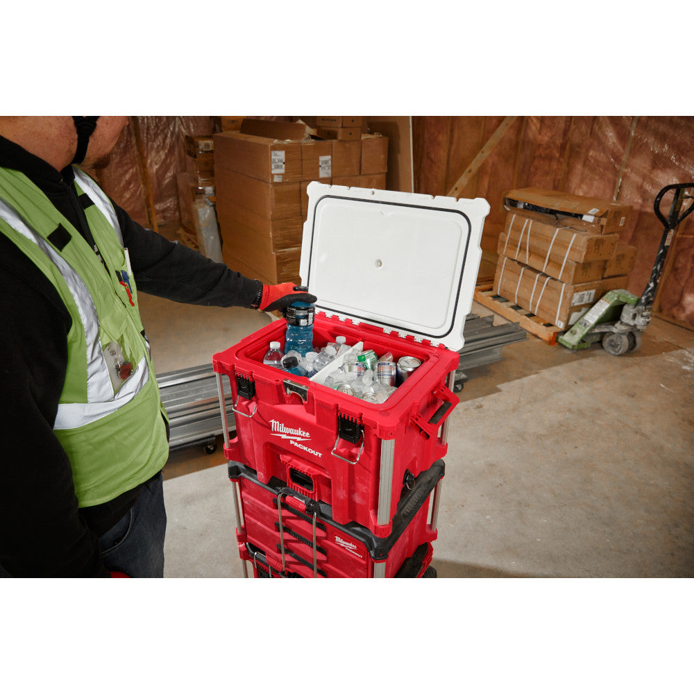Red PACKOUT cooler with white removable divider insert organizing bottles and containers inside.