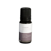 Small dark glass bottle with black screw cap labeled "Lavender" and ingredient list on white and purple label.