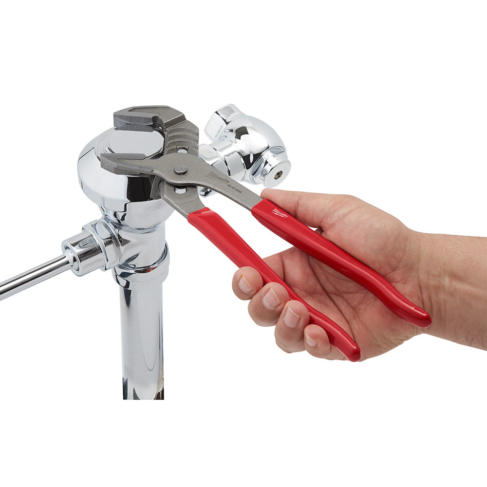 12-inch smooth jaw plier wrench with red handles gripping a chrome pipe fitting.
