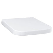 White elongated toilet seat with rounded edges and curved design.