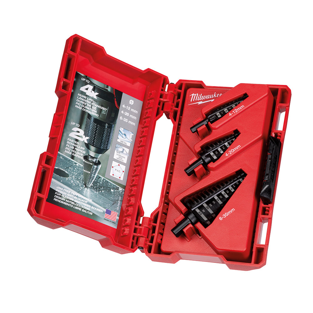 Three black metric step drill bits with stepped edges displayed in an open red Milwaukee plastic carrying case.