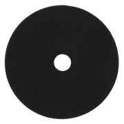 Black foam cutting pad, 5 inches diameter, with center hole for tool attachment.