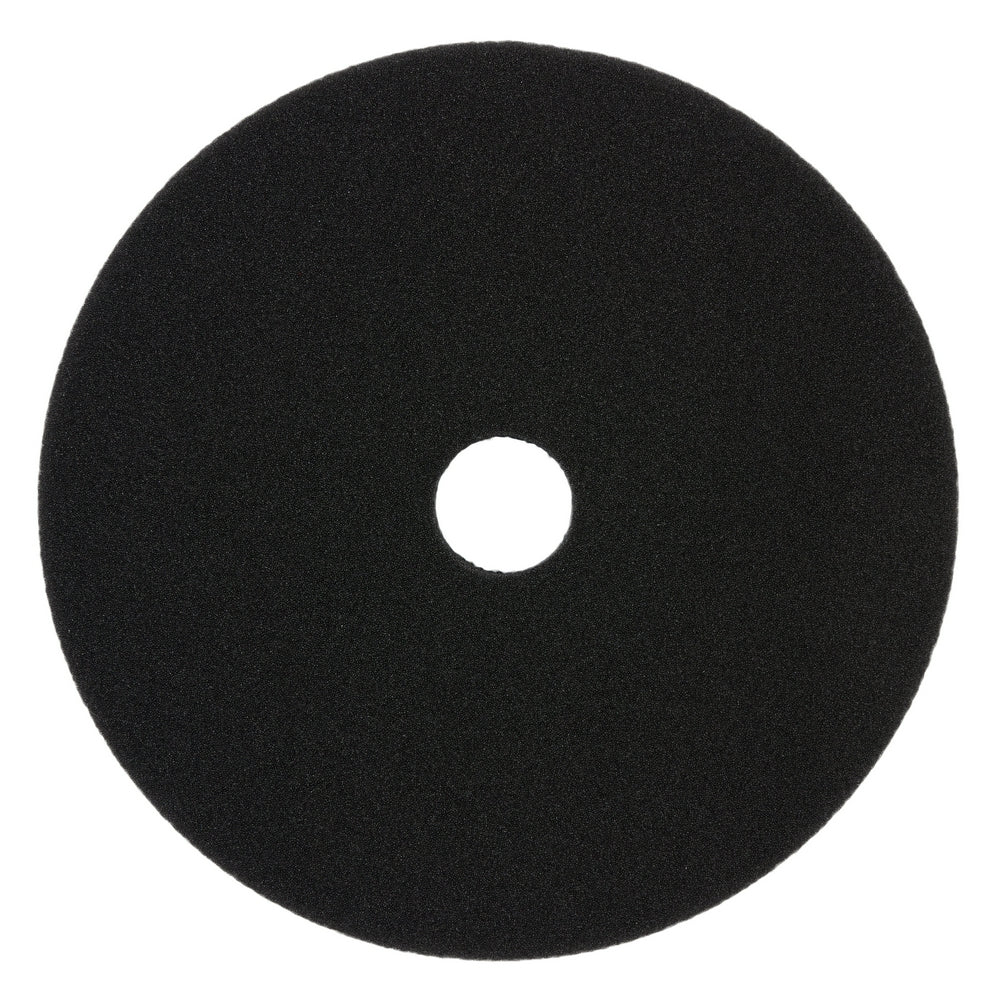 Black foam cutting pad, 5 inches diameter, with center hole for tool attachment.