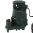 Dark green submersible pump with attached cable and power cord.