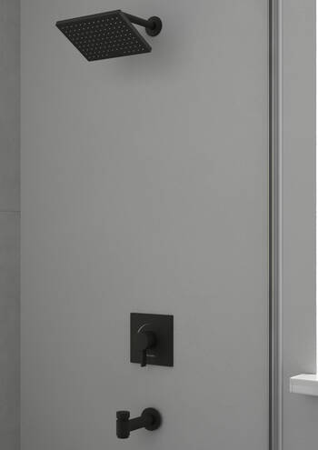 Matte black square shower trim with wall-mounted showerhead, control valve, and spout on white tile wall.