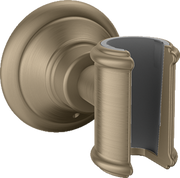 Brushed nickel wall-mounted handshower holder with circular backplate and curved cradle for shower hose.