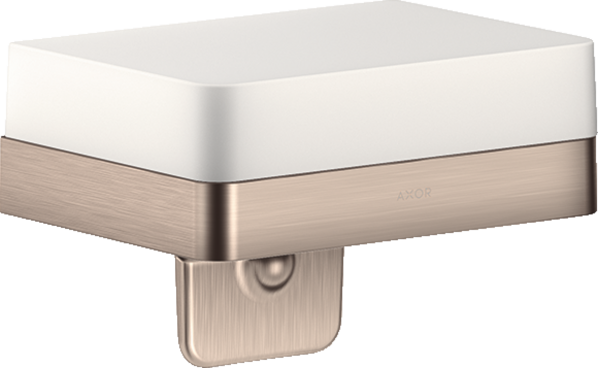 Brushed nickel soap dispenser with white ceramic shelf and soap pump below.