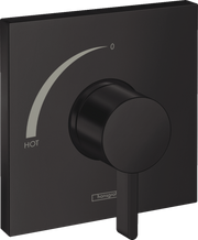 Matte black square pressure balance trim with circular handle, temperature dial marked "HOT," and Hansgrohe branding.