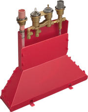 Brass thermostatic rough-in valve assembly with four outlets mounted on red support block.