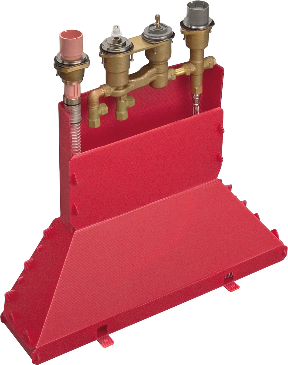 Brass thermostatic rough-in valve assembly with four outlets mounted on red support block.