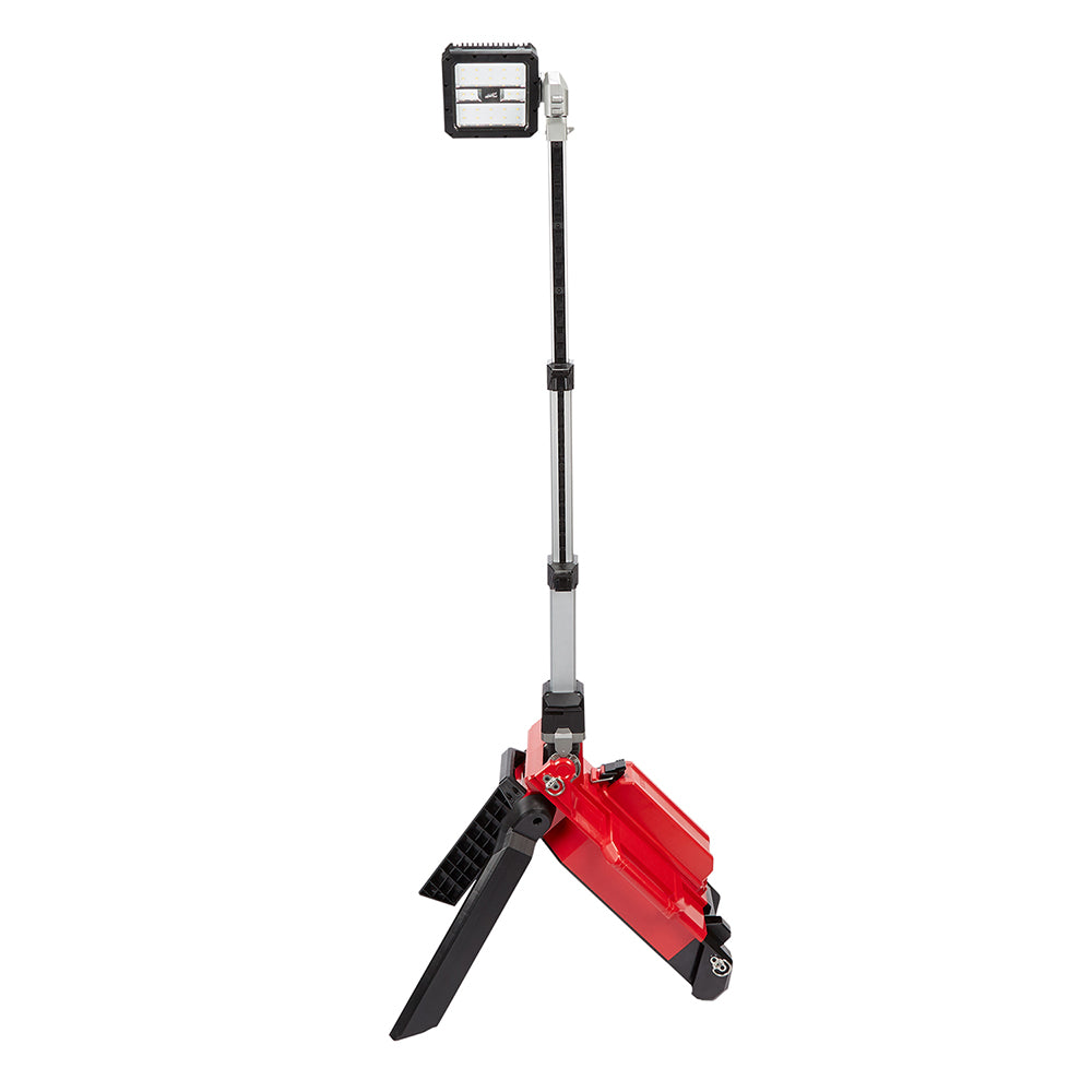 Red and black tower light with rectangular head on tripod stand and extendable pole.