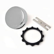 Bone-colored overflow kit with circular overflow cover, black star nut retainer, and metal adapter bar.