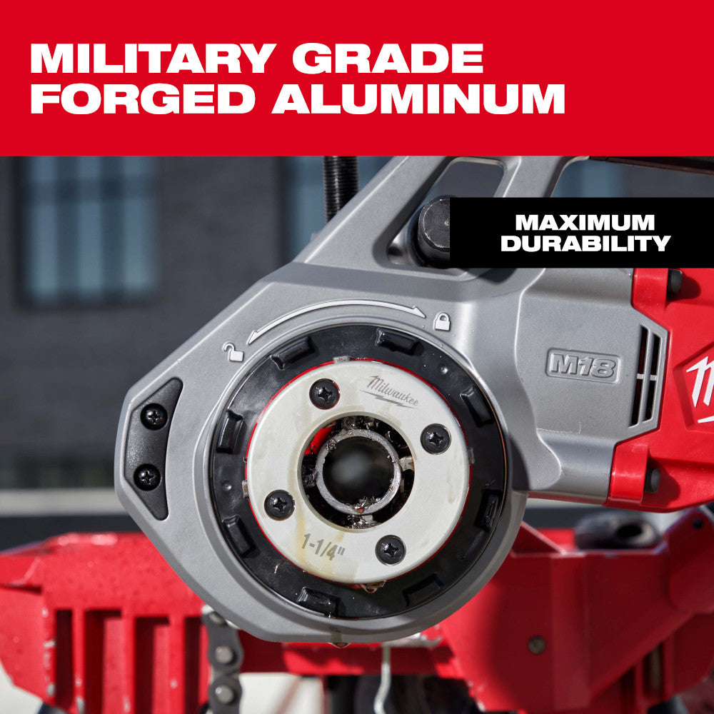 Silver and black forged aluminum pipe threading die head with 1-1/4" NPT marking mounted on red Milwaukee power tool.