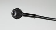 Black pipe guide attachment with ribbed grip handle and yellow-accented connector head on flexible shaft.