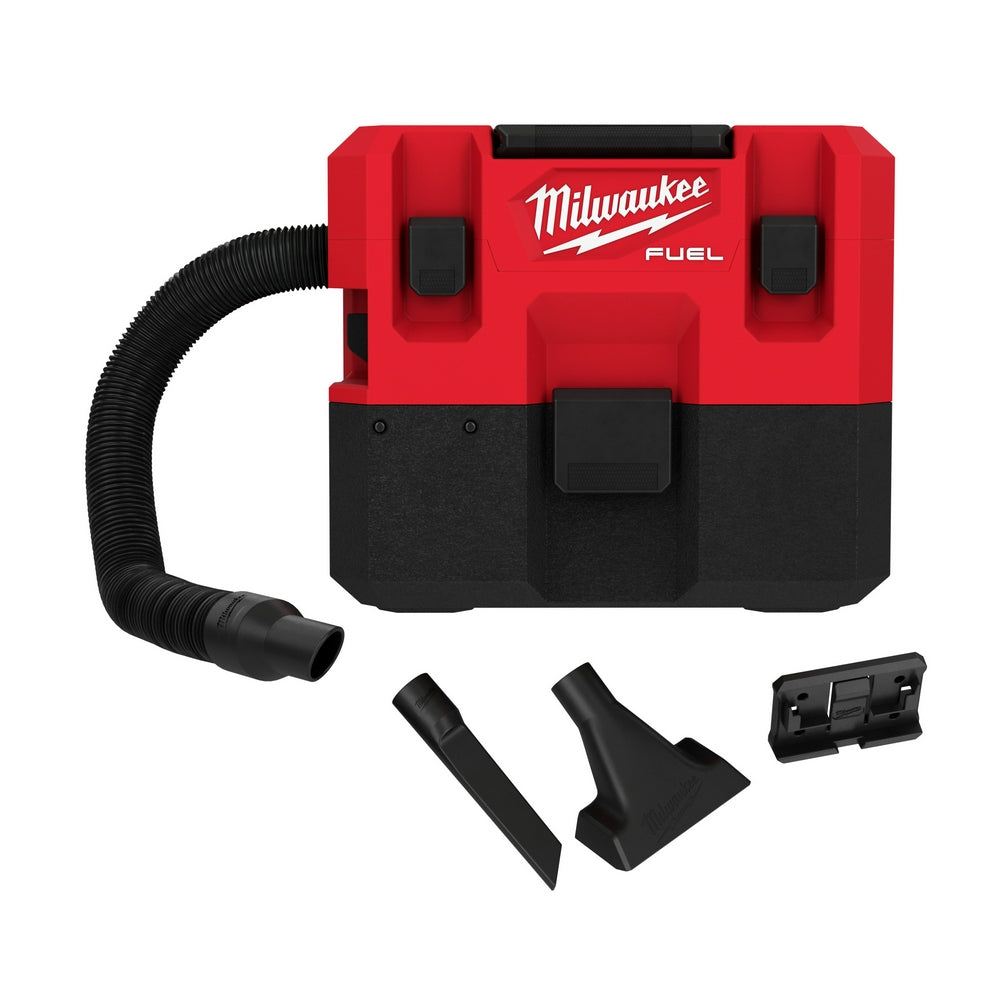 Red and black M12 FUEL wet/dry vacuum with attached hose and three black accessory attachments.