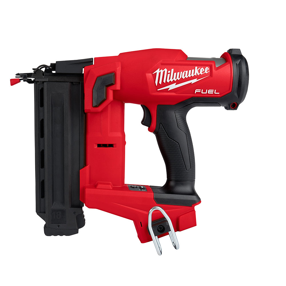 Red and black Milwaukee M18 FUEL brad nailer with black magazine and metal bail on white background.