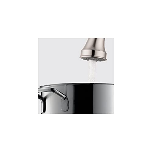 Chrome high-arc kitchen faucet with pull-down spray head over stainless steel pot.