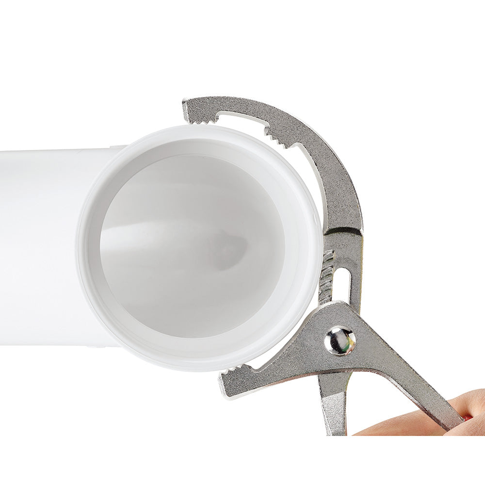 Metal pliers with textured grip jaws positioned around a white cylindrical filter.
