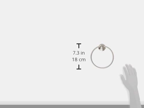 Brushed nickel wall-mount towel ring with 7.3 inch diameter shown with measurement scale and hand for size reference.