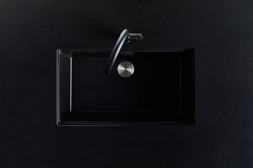Black granite undermount kitchen sink with single bowl and chrome faucet shown from above.