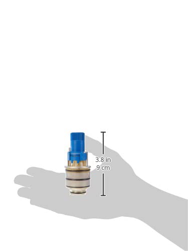 Grohe 47483000 3/4" thermostatic compact cartridge with blue handle and brass body shown in hand for scale.