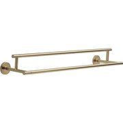 Brushed gold double towel bar with two parallel horizontal rods mounted on circular wall plates.