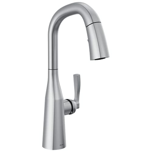 Chrome pull-down kitchen faucet with single handle lever and high arched spout.