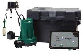 Green and black residential grinder pump system with control panel, cord, and accessories.