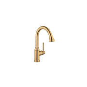 Brushed gold kitchen faucet with high arc spout and pull-down spray head.