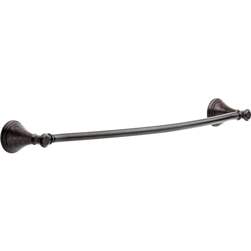 Curved metal towel bar with decorative end caps in oil-rubbed bronze finish.