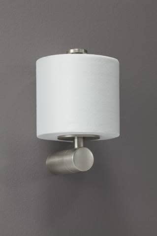 Chrome paper holder with white cylindrical roll and round chrome mounting bracket on gray wall.
