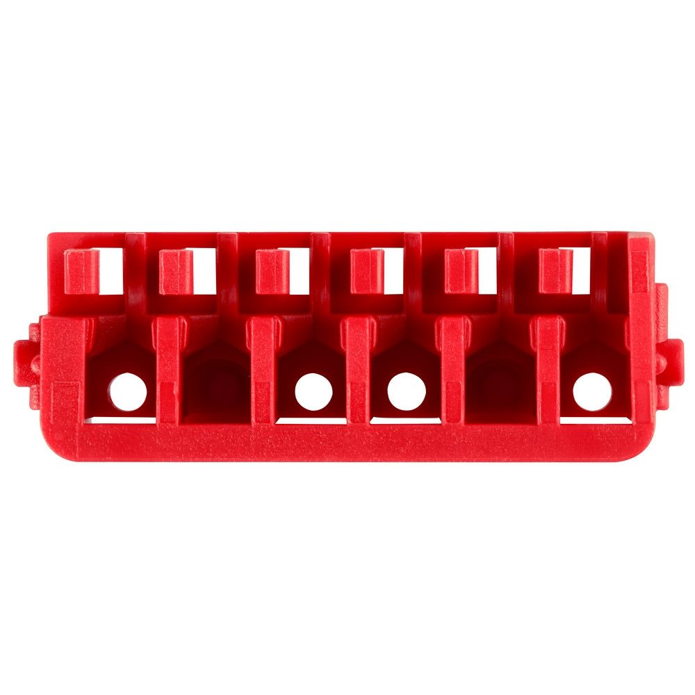 Red plastic organizer case with six compartments and circular holes for storing impact driver bits and accessories.
