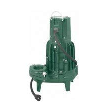 Green submersible sewage pump with cylindrical body, outlet port, and attached electrical cord.