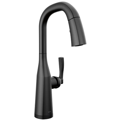 Matte black single-handle kitchen faucet with curved spout and pull-down spray head.