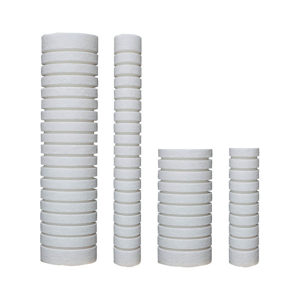 White polypropylene sediment filters with grooved cylindrical design in varying heights displayed in four stacks.