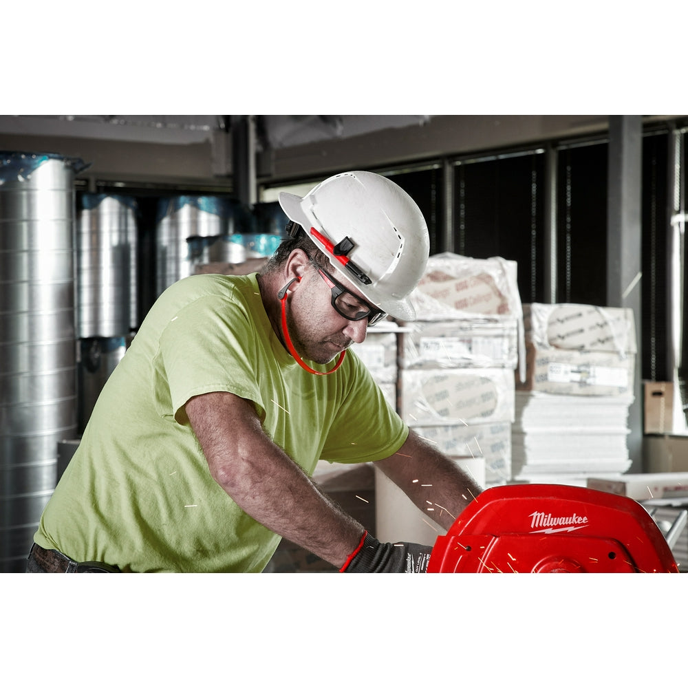 Worker wearing white hard hat with red and white banded ear plugs connected by a band around the neck.